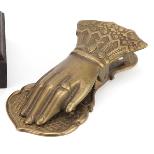 1169 - Metalware including a Victorian style letter clip in the form of a hand, silvered figure of a mother... 