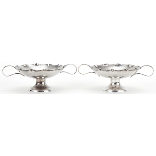 1021 - Wang Hing, pair of Chinese export silver sweetmeat dishes with twin handles, each 15.5cm wide, total... 