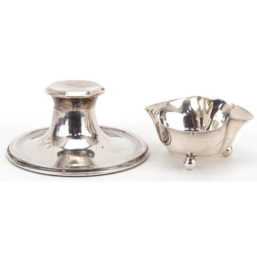 1133 - Circular silver inkwell and silver club shaped dish raised on three ball feet, the largest 10.5cm in... 