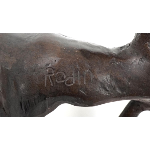 1072 - Large patinated bronze study of a lion, 31cm in length