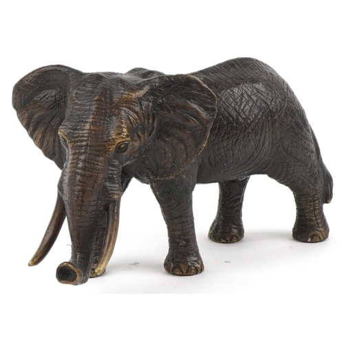 1209 - Japanese bronze okimono of a bull elephant, 30cm in length