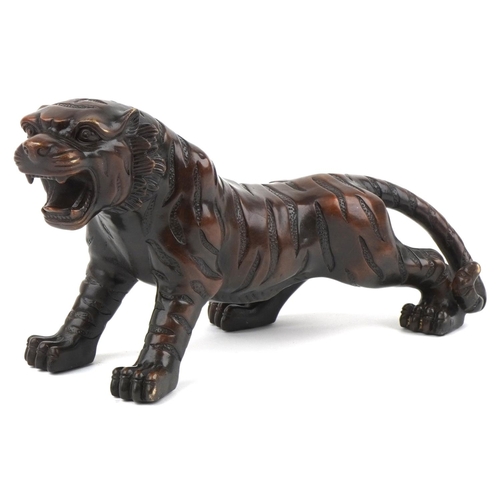 1115 - Japanese patinated bronze okimono figure of a tiger, 34cm in length