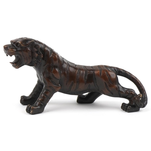 1115 - Japanese patinated bronze okimono figure of a tiger, 34cm in length