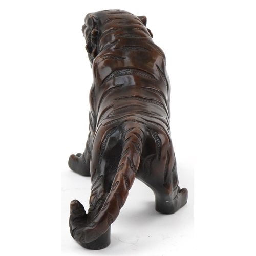 1115 - Japanese patinated bronze okimono figure of a tiger, 34cm in length