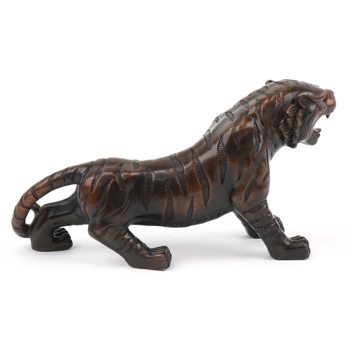 1115 - Japanese patinated bronze okimono figure of a tiger, 34cm in length