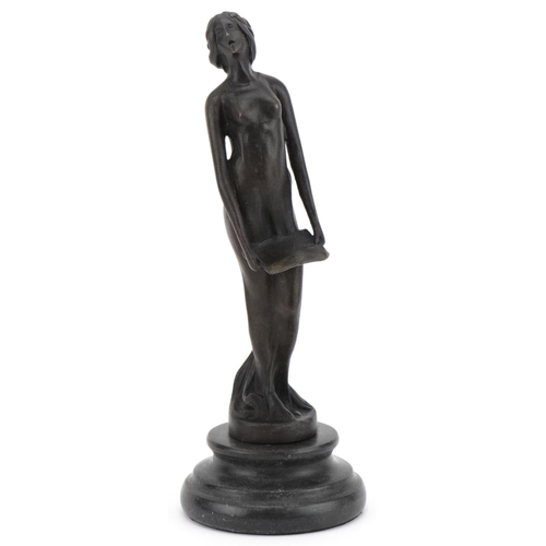 2217 - Patinated bronze figure of an Art Nouveau female holding a tray, raised on a black marble base, 19.5... 