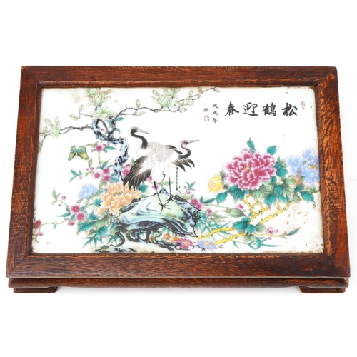 1357 - Chinese hardwood tray inset with a porcelain panel hand painted with cranes amongst flowers, 28cm wi... 