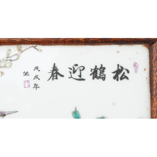 1357 - Chinese hardwood tray inset with a porcelain panel hand painted with cranes amongst flowers, 28cm wi... 