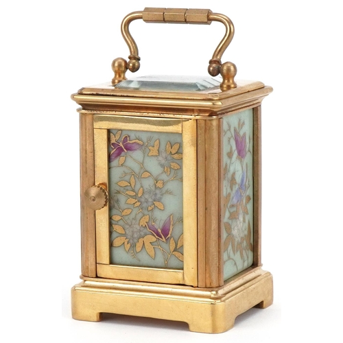 1092 - Miniature brass cased carriage clock with Sèvres type porcelain panels decorated with butterflies am... 