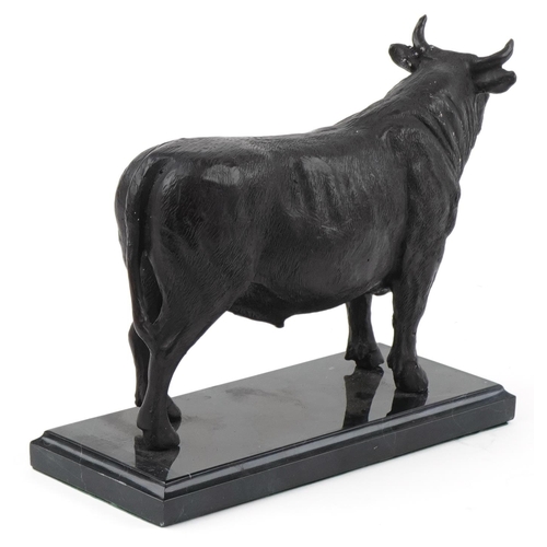 2292 - Patinated bronze study of a bull raised on a black marble base, 26cm in length