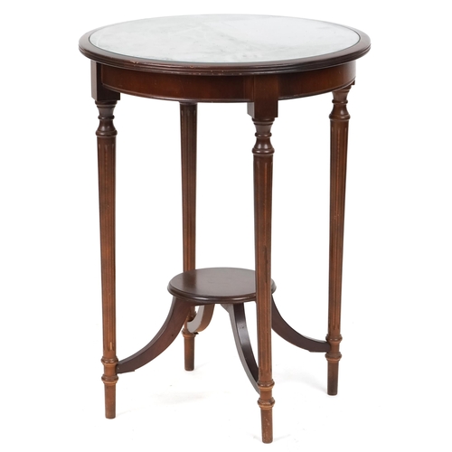 716 - Edwardian mahogany circular occasional table with under tier raised on reeded legs, 73cm high x 54cm... 