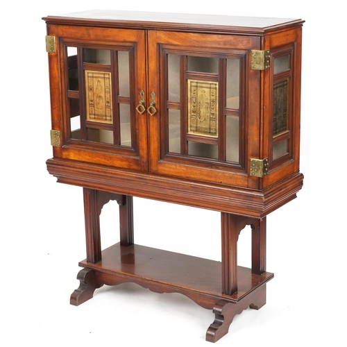 599 - Edwardian mahogany display cabinet on stand, the doors and sides each fitted with a brass panel depi... 