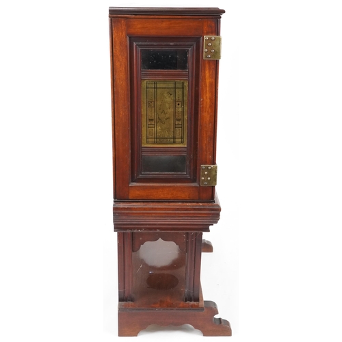 599 - Edwardian mahogany display cabinet on stand, the doors and sides each fitted with a brass panel depi... 