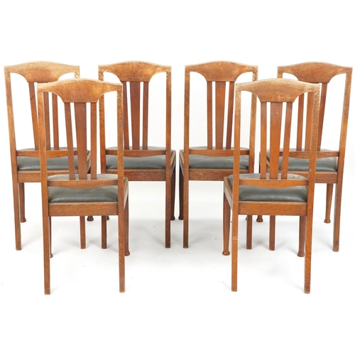 601 - Set of six early 20th century Arts & Crafts oak dining chairs with carved back rails above drop in s... 