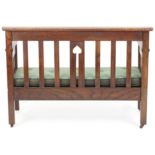 600 - Early 20th century Arts & Crafts oak two seat hall settle retailed by Liberty & Co, 80cm H x 112cm W... 