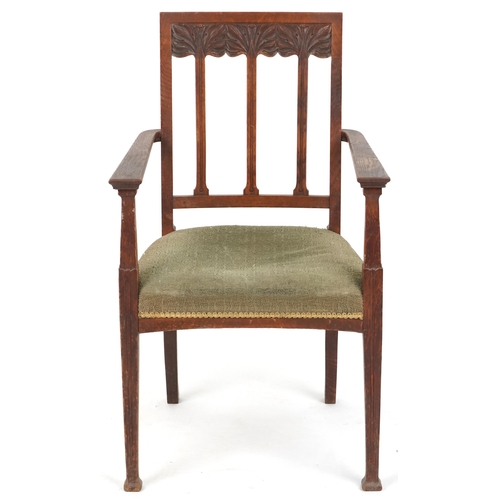 627 - Edwardian oak open armchair with carved decoration, 69cm H x 59cm W x 51cm D