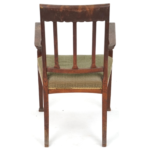 627 - Edwardian oak open armchair with carved decoration, 69cm H x 59cm W x 51cm D