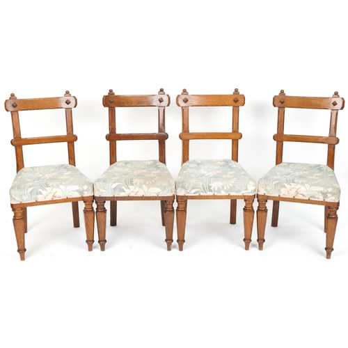 608 - Set of four early 20th century Gothic revival oak dining chairs with overstuffed seats, 91cm H x 47c... 