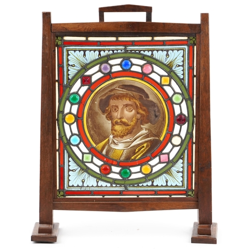 105 - Arts & Crafts oak and leaded glazed fire screen, the central panel with hand painted panel of a bear... 