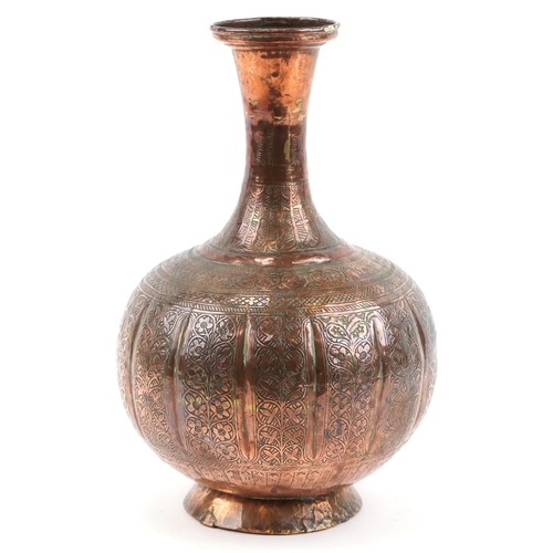 1326 - Middle Eastern copper vase profusely engraved with foliage, 32cm high