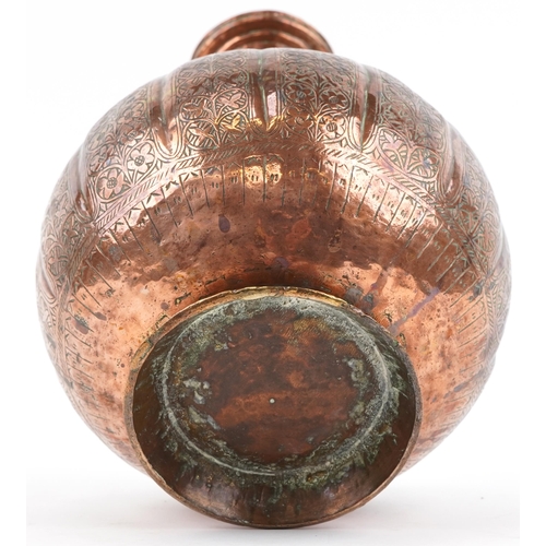 1326 - Middle Eastern copper vase profusely engraved with foliage, 32cm high