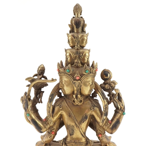 1155 - Tibetan bronze Buddha seated in the lotus position set with turquoise and coral coloured cabochons, ... 