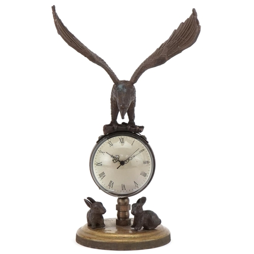 2205 - Bronzed and glass globular desk clock mounted with an eagle, 21cm high