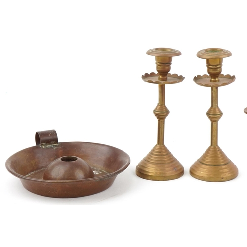 26 - Christopher Dresser Arts & Crafts copper and brass candlesticks and a brass chamberstick, the larges... 