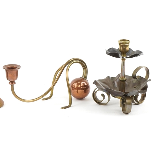 26 - Christopher Dresser Arts & Crafts copper and brass candlesticks and a brass chamberstick, the larges... 