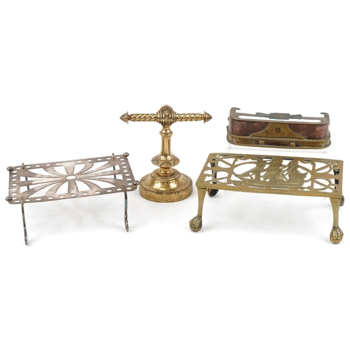 144 - Arts & Crafts fireside metalware including miniature fireguard, trivets and a brass doorstop, the la... 