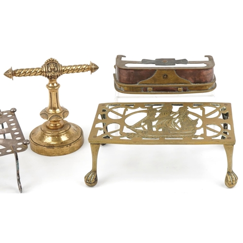 144 - Arts & Crafts fireside metalware including miniature fireguard, trivets and a brass doorstop, the la... 