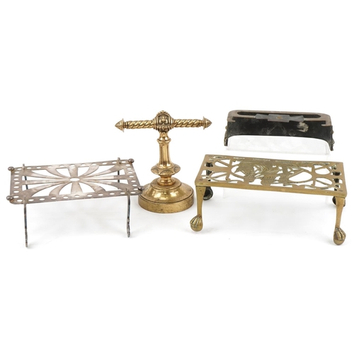 144 - Arts & Crafts fireside metalware including miniature fireguard, trivets and a brass doorstop, the la... 