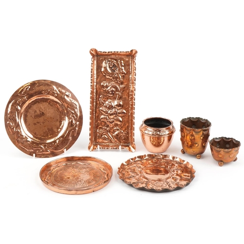 175 - Arts & Crafts copperware including floral and fish design trays, pots etc, the largest 25cm in diame... 