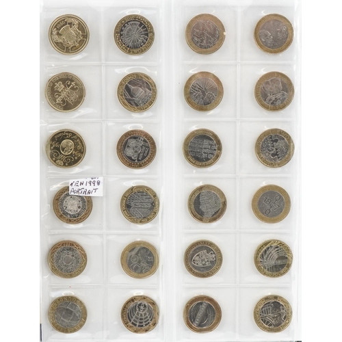 2447 - Coin album containing sixty six two pound coins and thirty pounds in fifty pence pieces, all legal t... 