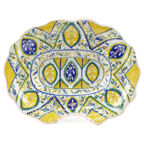 1119 - Turkish Ottoman Kutahya barber's bowl hand painted with stylized flowers and foliage, 37cm wide