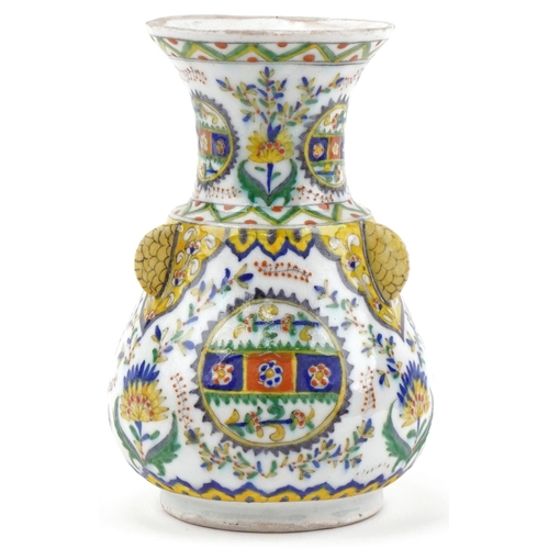 1121 - Turkish Ottoman Kutahya vase hand painted with stylized flowers and foliage, 21.5cm high