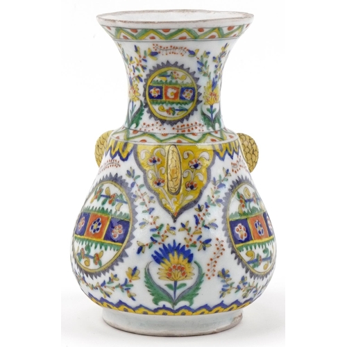 1121 - Turkish Ottoman Kutahya vase hand painted with stylized flowers and foliage, 21.5cm high