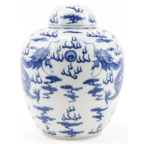 1295 - Large Chinese blue and white porcelain ginger jar and cover hand painted with dragons chasing the fl... 