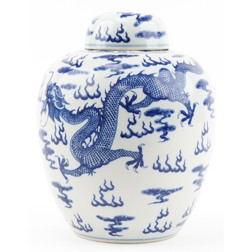 1295 - Large Chinese blue and white porcelain ginger jar and cover hand painted with dragons chasing the fl... 