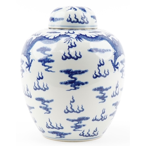 1295 - Large Chinese blue and white porcelain ginger jar and cover hand painted with dragons chasing the fl... 