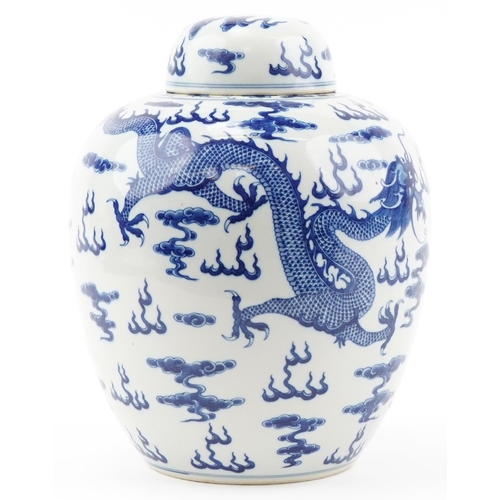 1295 - Large Chinese blue and white porcelain ginger jar and cover hand painted with dragons chasing the fl... 