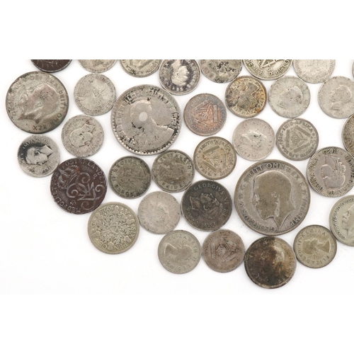 2404 - British and world silver and white metal coinage including 1923 half crown, total weight 145g