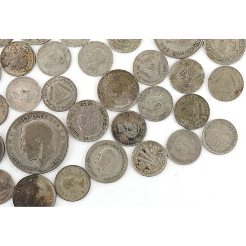 2404 - British and world silver and white metal coinage including 1923 half crown, total weight 145g