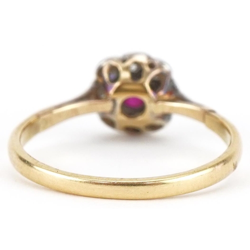 3053 - Unmarked gold diamond and ruby flower head ring, size M, 1.9g