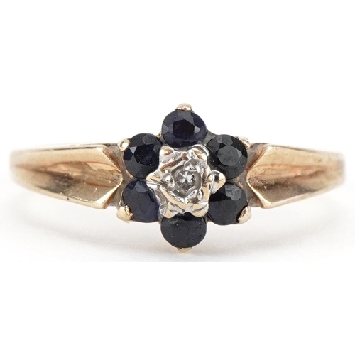 3162 - 9ct gold diamond and blue spinel flower head ring, size J/K, 1.3g