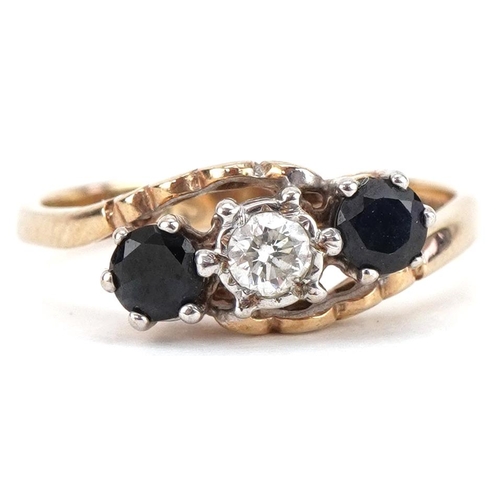 3194 - 9ct gold diamond and sapphire three stone crossover ring, the diamond approximately 3.0mm in diamete... 