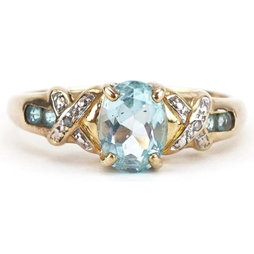 3441 - 9ct gold blue topaz solitaire ring set with diamonds and aquamarines to the shoulders, size T, 3.0g