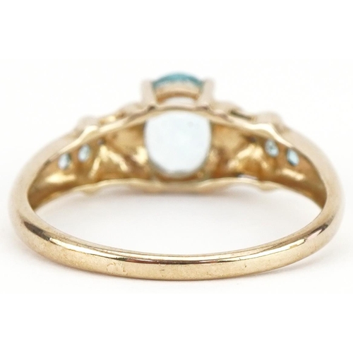 3441 - 9ct gold blue topaz solitaire ring set with diamonds and aquamarines to the shoulders, size T, 3.0g