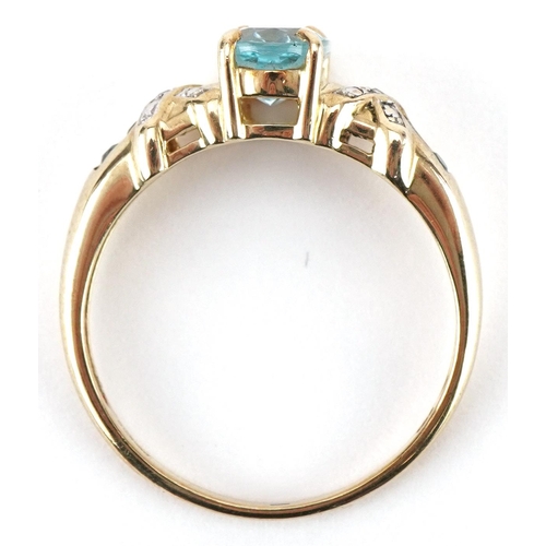 3441 - 9ct gold blue topaz solitaire ring set with diamonds and aquamarines to the shoulders, size T, 3.0g