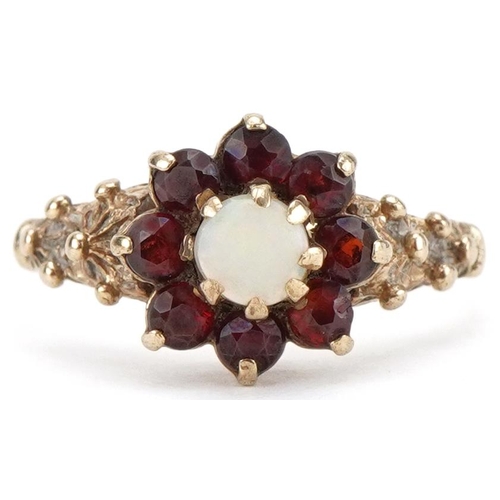 3313 - 9ct gold opal and garnet flower head ring with naturalistic setting, size K, 1.8g